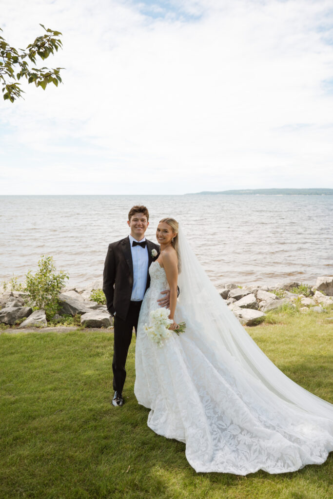 Bride and groom lakeside wedding photos